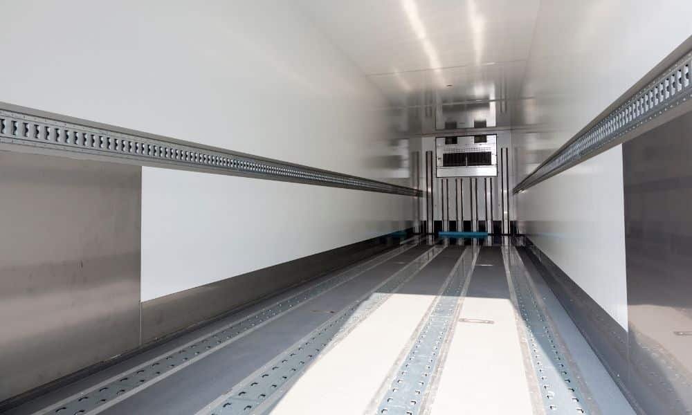 Interior of a multi-temperature refrigerated truck cargo body used for combined chilled and frozen loads in Fujairah